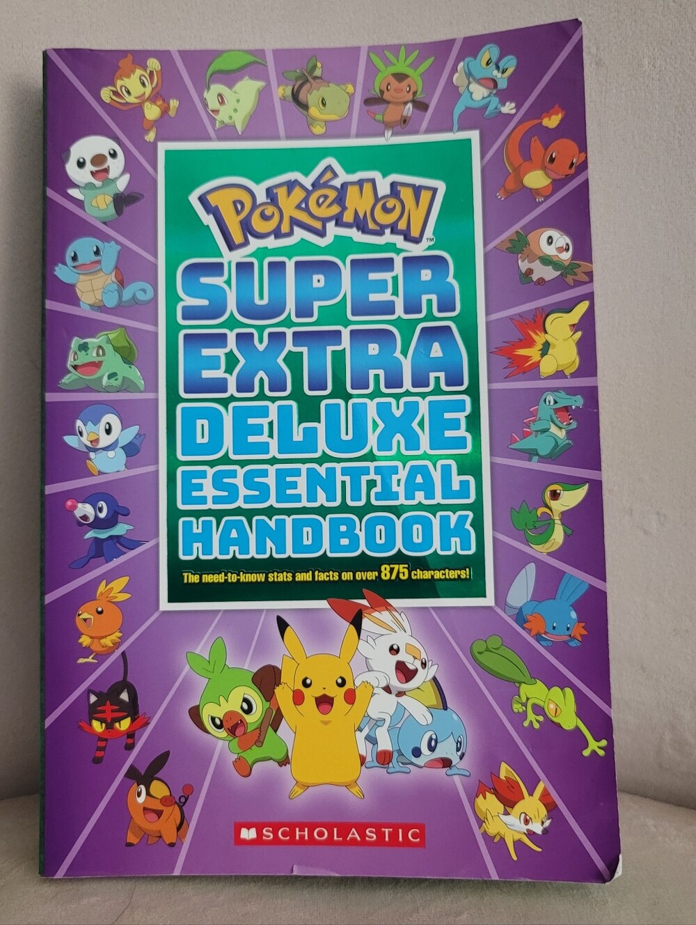 Pokémon Super Extra Deluxe Essential Handbook - Purple Cover